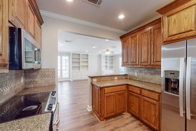 kitchen featuring light hardwood / wood-style floors, tasteful backsplash, light stone countertops, stainless steel appliances, and ceiling fan