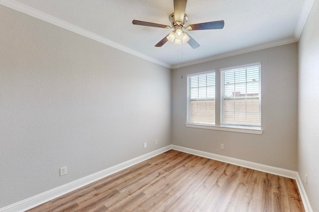 unfurnished room with crown molding, light hardwood / wood-style floors, and ceiling fan