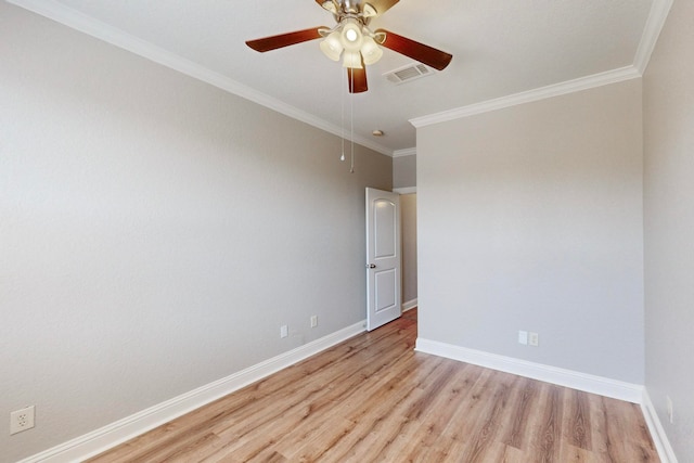 spare room featuring ornamental molding, ceiling fan, and light hardwood / wood-style flooring