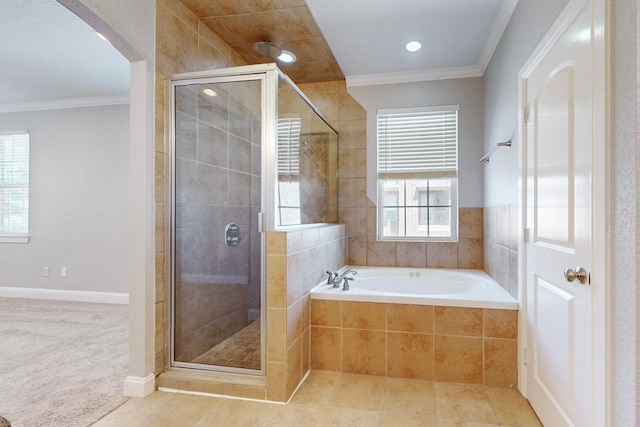 bathroom with plus walk in shower, tile patterned floors, and crown molding