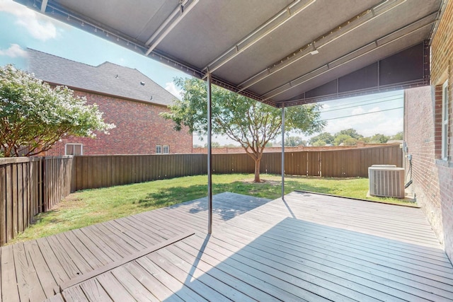 wooden deck with a yard and central air condition unit