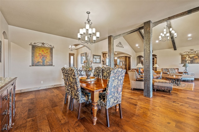 dining space with wood-type flooring, beamed ceiling, a notable chandelier, high vaulted ceiling, and ornate columns