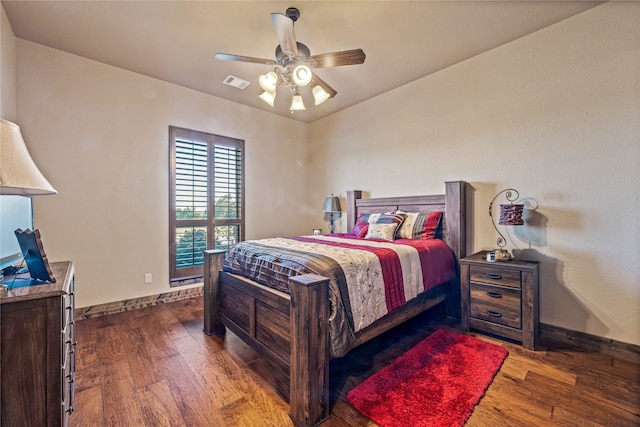 bedroom featuring ceiling fan and dark hardwood / wood-style flooring