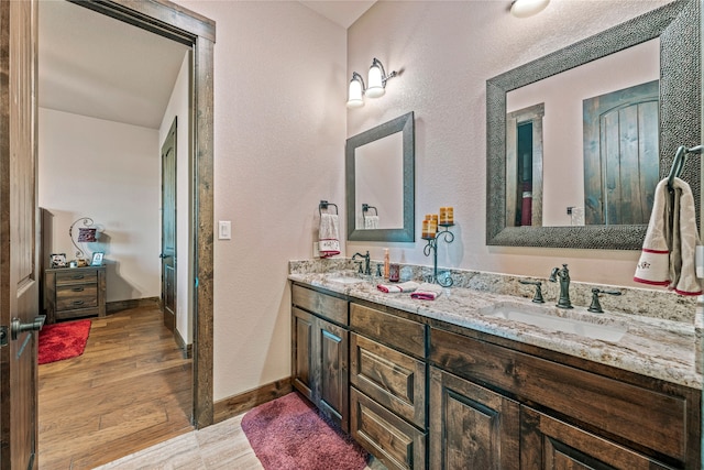 bathroom with wood-type flooring and vanity