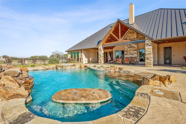 view of swimming pool featuring a patio area