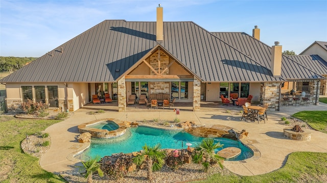 back of property with a patio and a swimming pool with hot tub