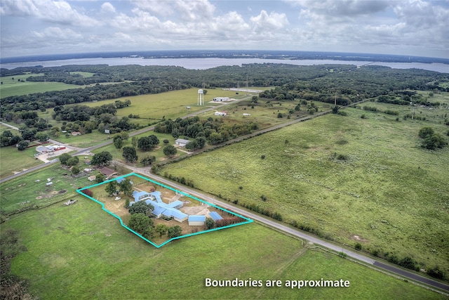 birds eye view of property with a water view and a rural view