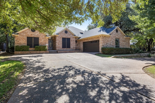 single story home featuring a garage