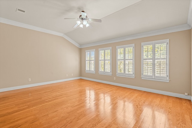 unfurnished room featuring light wood-type flooring, lofted ceiling, ceiling fan, and crown molding