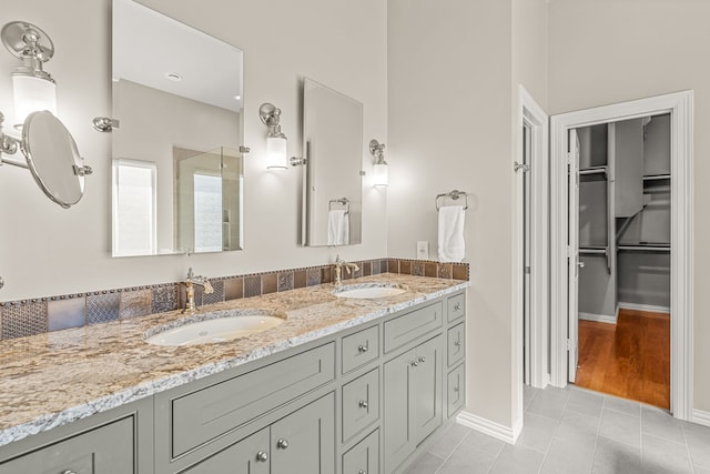 bathroom featuring tile patterned flooring and vanity