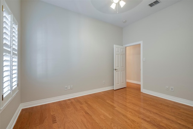 unfurnished room with light hardwood / wood-style floors and ceiling fan