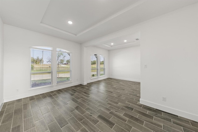 empty room with a tray ceiling