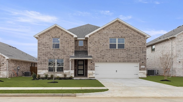 front of property featuring central AC, a garage, and a front lawn