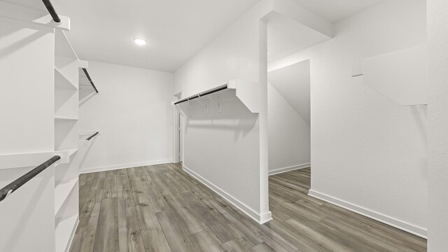 bathroom featuring vanity, plus walk in shower, and tile patterned flooring