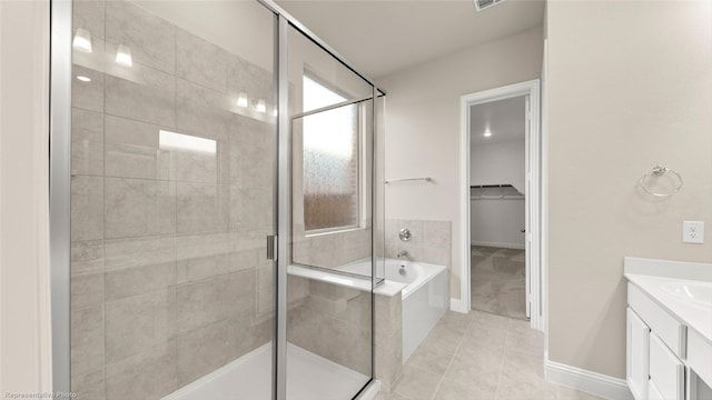 bathroom with shower with separate bathtub, tile patterned flooring, and vanity