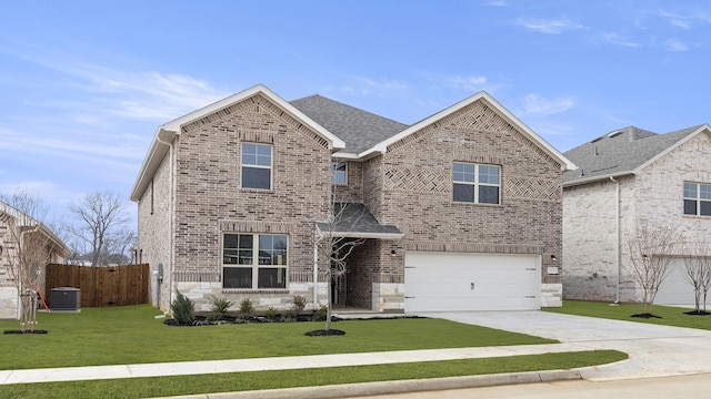 view of front of property featuring central AC unit, a garage, and a front yard