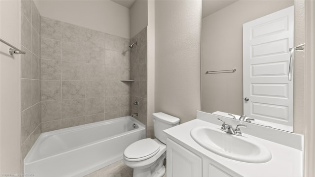 full bathroom with vanity, toilet, and tiled shower / bath