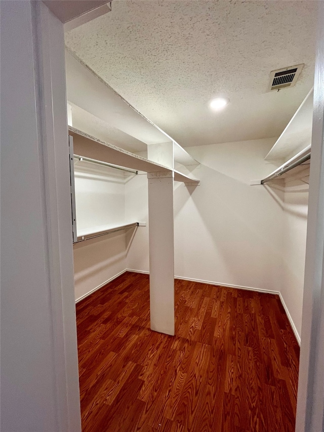 walk in closet featuring hardwood / wood-style floors