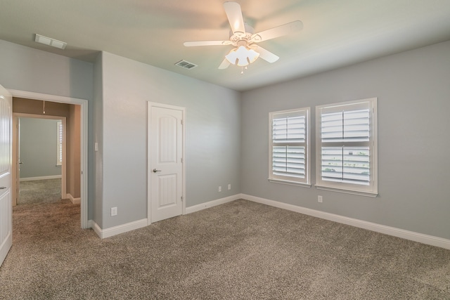 unfurnished bedroom featuring carpet floors and ceiling fan