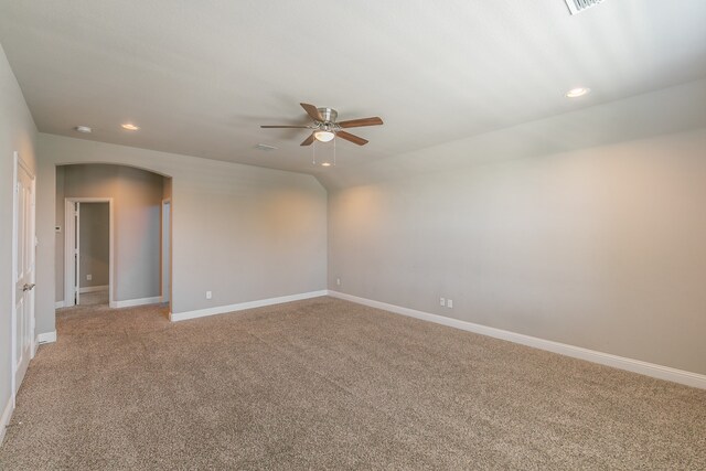 carpeted empty room featuring ceiling fan