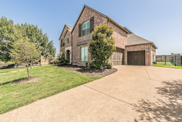 view of front property with a garage and a front lawn