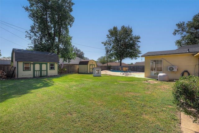 view of yard with a shed and a patio