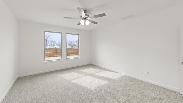 empty room featuring ceiling fan and carpet flooring