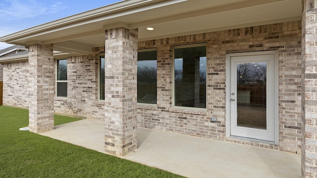 property entrance featuring a patio