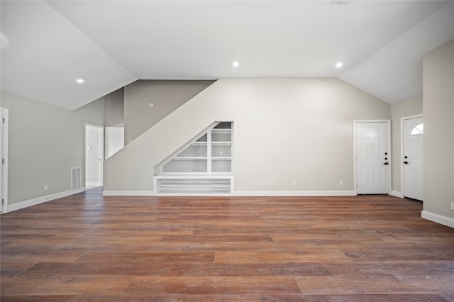 bonus room with lofted ceiling and dark hardwood / wood-style flooring