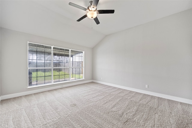 empty room with carpet, vaulted ceiling, and ceiling fan