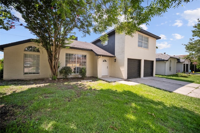 front facade featuring a front yard and a garage