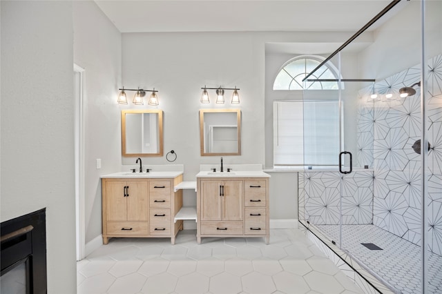 bathroom featuring tile patterned flooring, vanity, and an enclosed shower