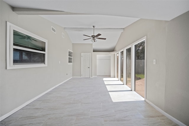 spare room with vaulted ceiling with beams and ceiling fan