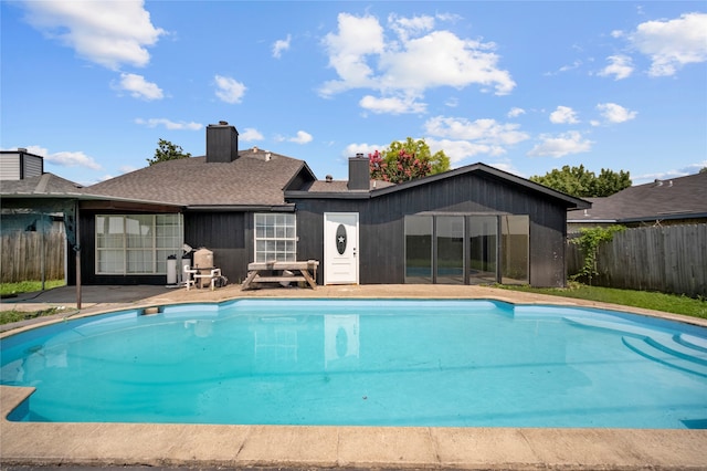 view of swimming pool featuring a patio area