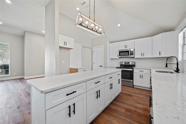 kitchen with white cabinetry, sink, stainless steel appliances, and dark hardwood / wood-style flooring