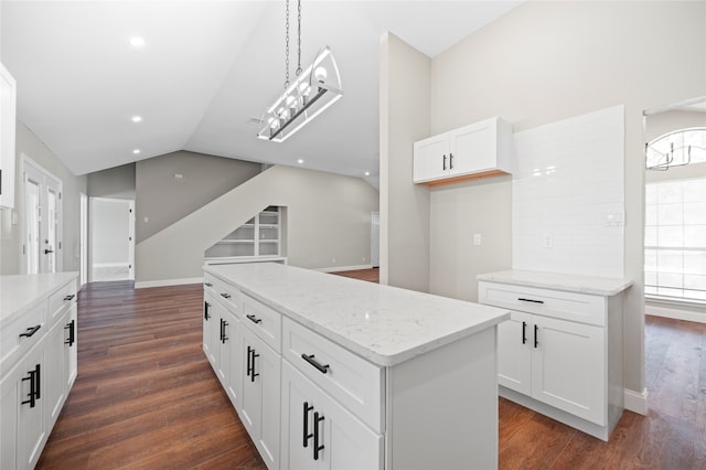 kitchen with lofted ceiling, dark hardwood / wood-style flooring, and a wealth of natural light