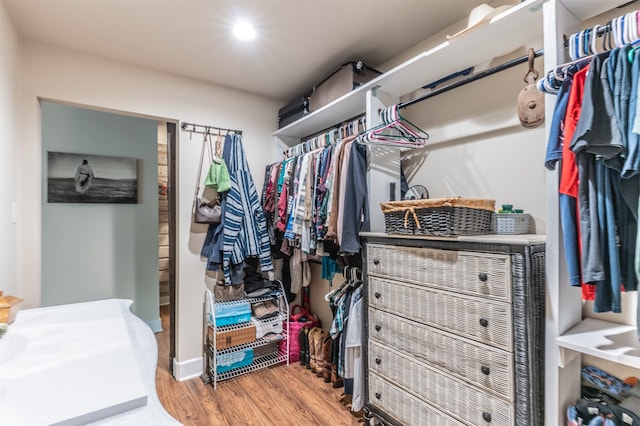 walk in closet featuring light hardwood / wood-style flooring