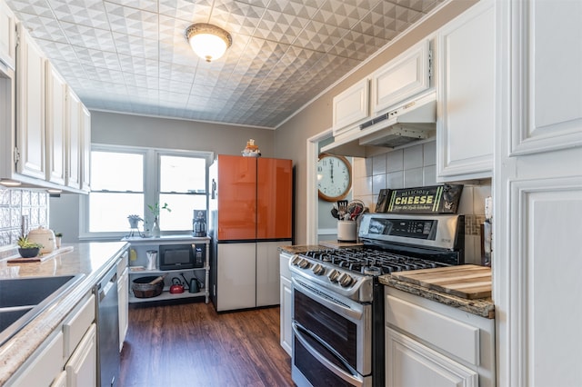 kitchen featuring crown molding, white cabinetry, and stainless steel appliances