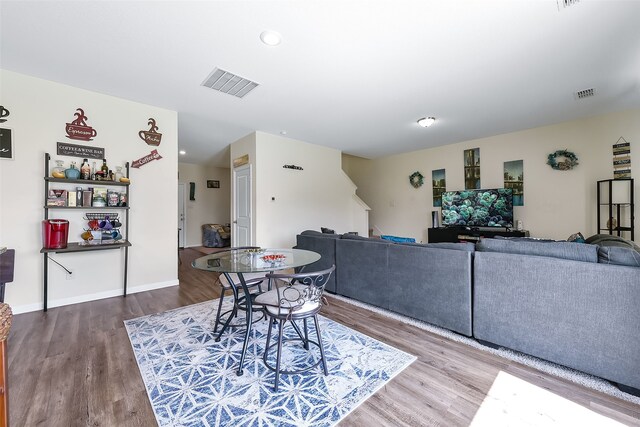 dining room with hardwood / wood-style flooring