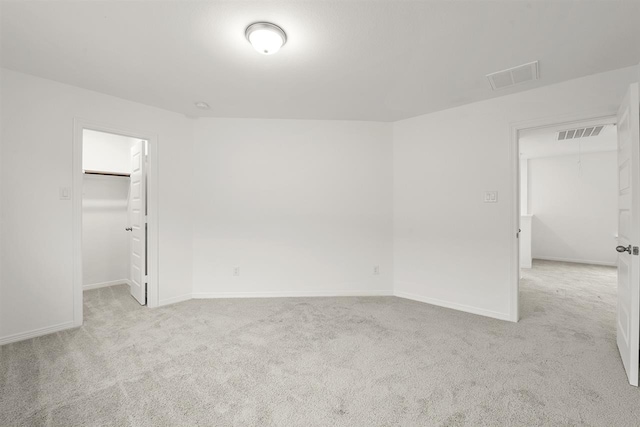 spare room with light carpet