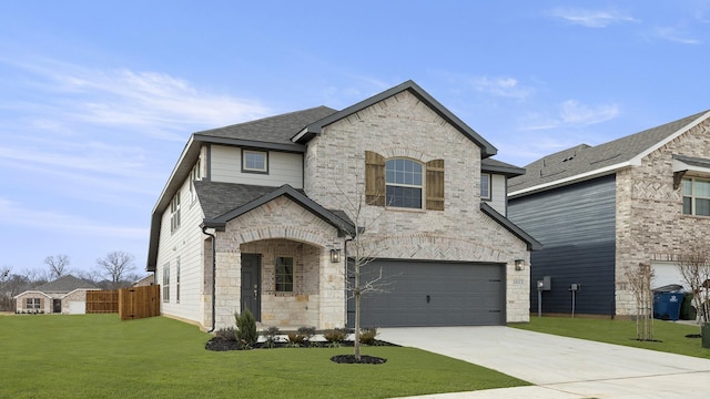 french country inspired facade featuring a garage and a front lawn