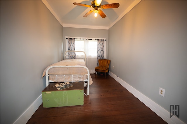 bedroom with ornamental molding, dark hardwood / wood-style floors, and ceiling fan