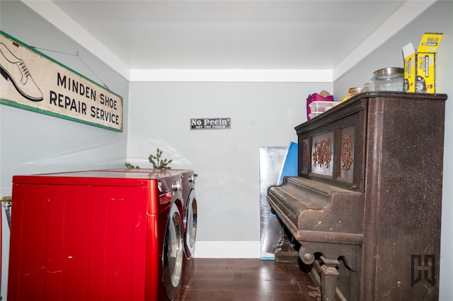 laundry room featuring washing machine and dryer and dark wood-type flooring