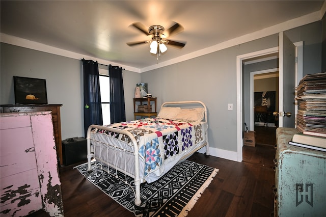 bedroom with ceiling fan, ornamental molding, and dark wood-type flooring