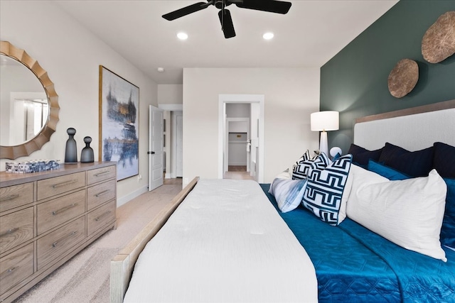 bedroom with light carpet and ceiling fan