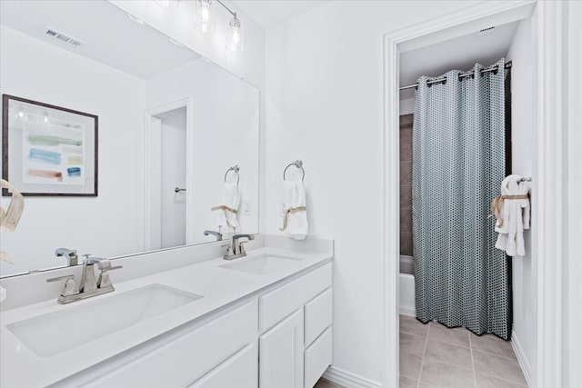 bathroom with shower / bath combination with curtain, tile patterned floors, and vanity