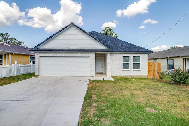 view of front facade with a garage and a front yard