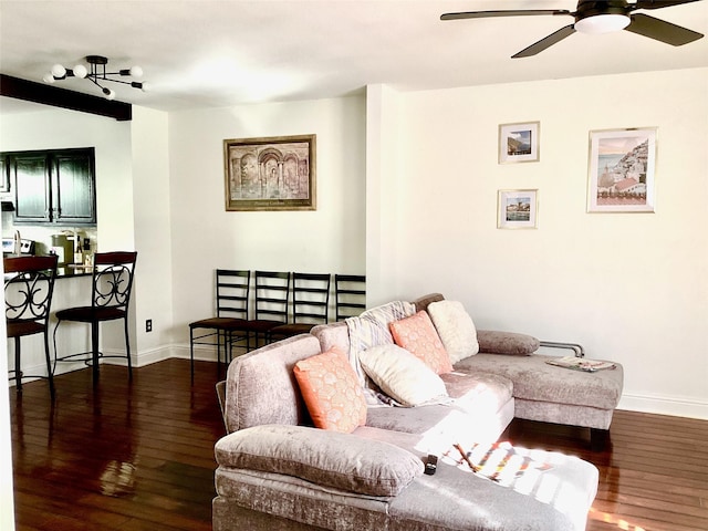 living room with ceiling fan, baseboards, and dark wood-style flooring