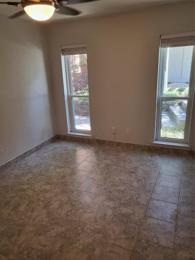 spare room featuring ceiling fan