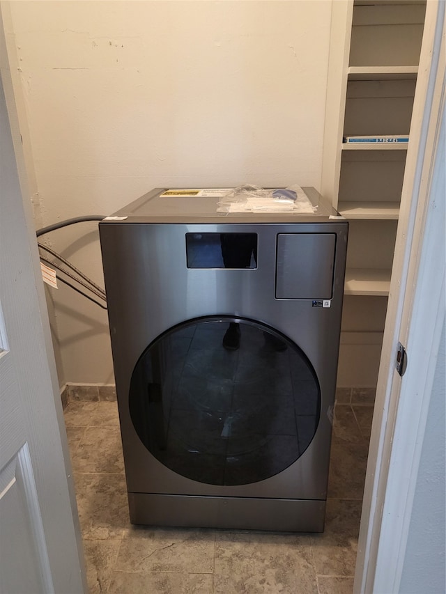 laundry area with washer / dryer